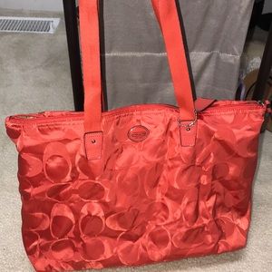 Coach bag with removable zipper pouch